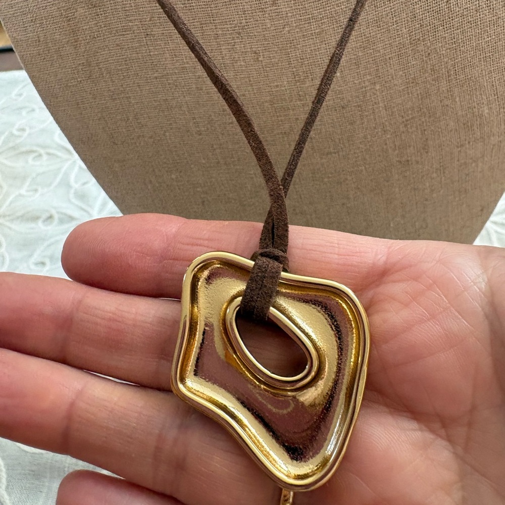 Elegant Gold Sculpture Long Pendant Necklace on Brown Cord - Picture 5 of 9